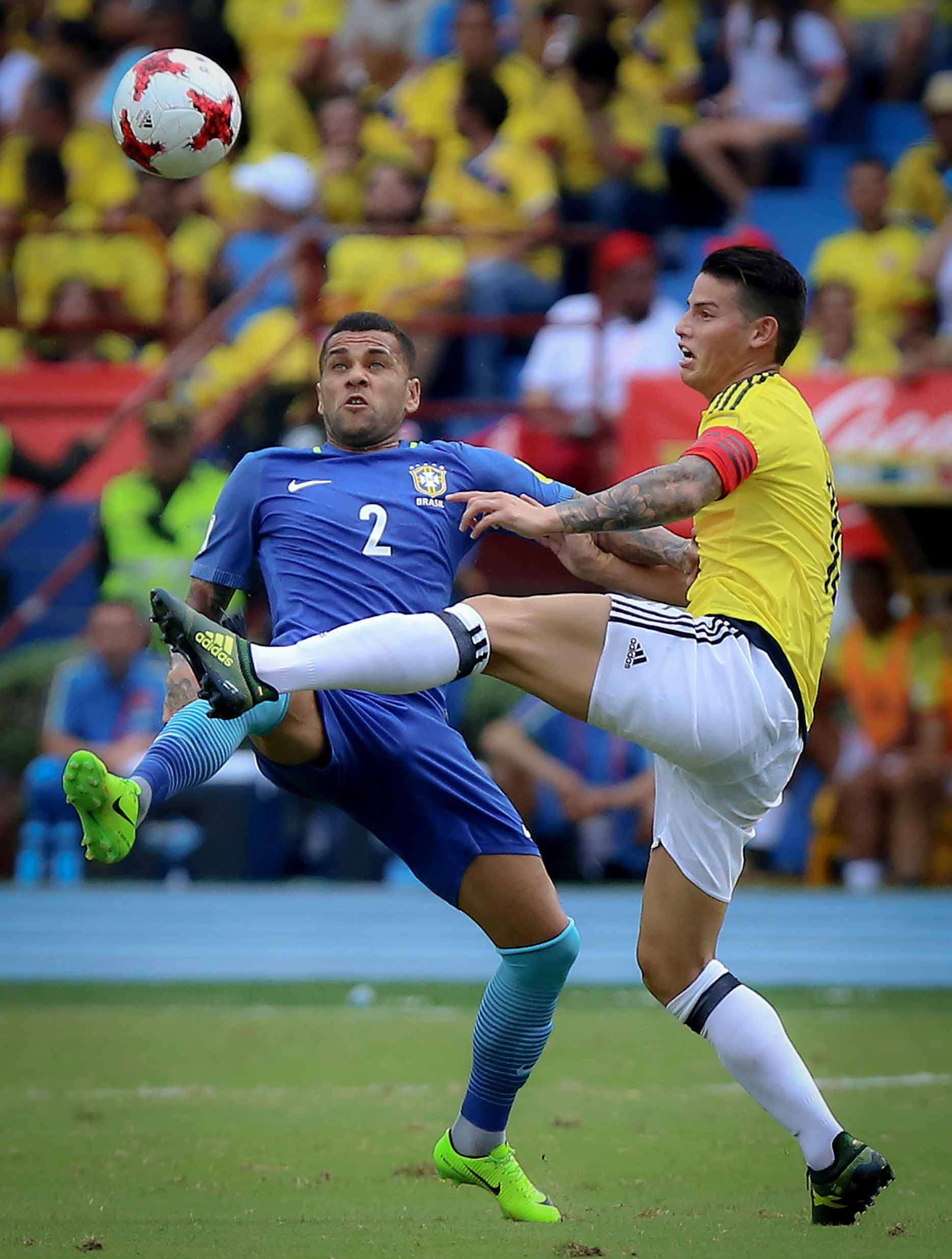 BARRANQUILLA, COLOMBIA - SEPTEMBER 05: James Rodriguez of Colombia and Daniel Silva of Brazil compete for the ball during a match between Colombia and Brazil as part of FIFA 2018 World Cup Qualifiers at Metropolitano Roberto Melendez Stadium on September 05, 2017 in Barranquilla, Colombia. (Photo by Inaldo Perez Castillo/Getty Images)